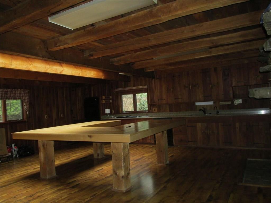 188 County Line Road Champion, PA 15622 - Photo 7 of 25 The island was used as dinner table. Take note of the ceiling beams!