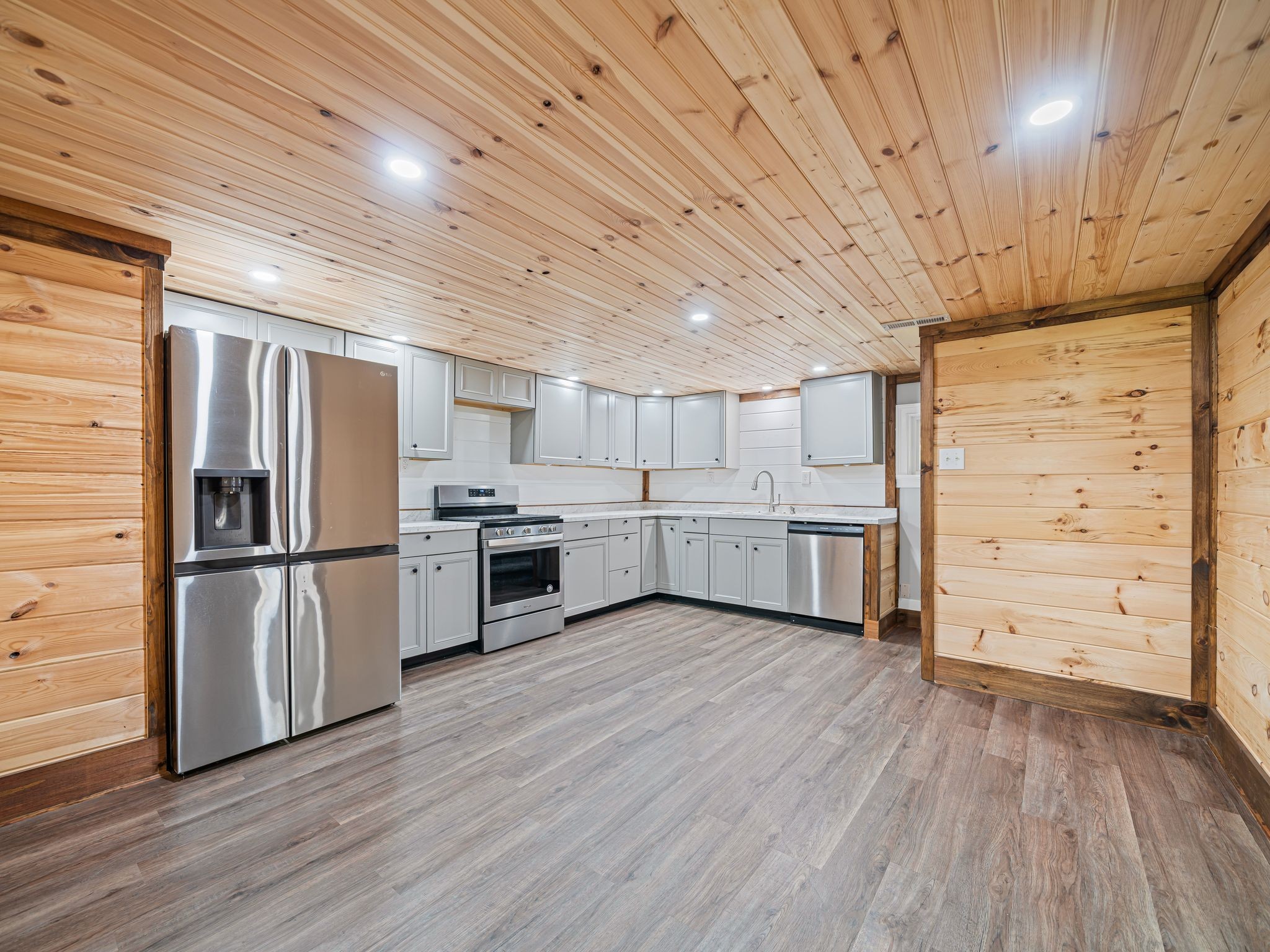 111 Brannon Circle Dickson, TN 37055 - Photo 15 of 34 a kitchen with stainless steel appliances a refrigerator and wooden floor