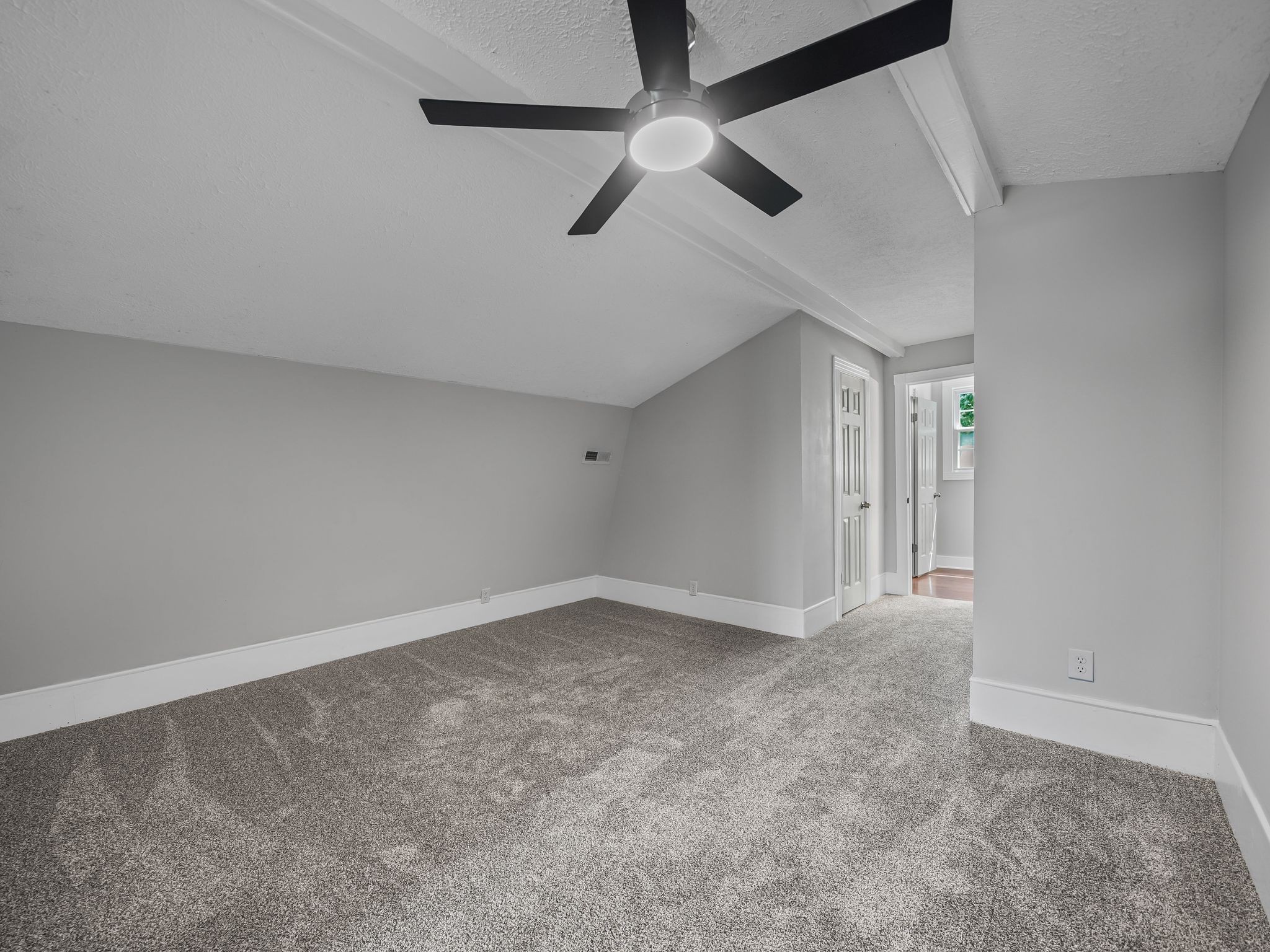111 Brannon Circle Dickson, TN 37055 - Photo 17 of 34 an empty room with a ceiling fan and carpet
