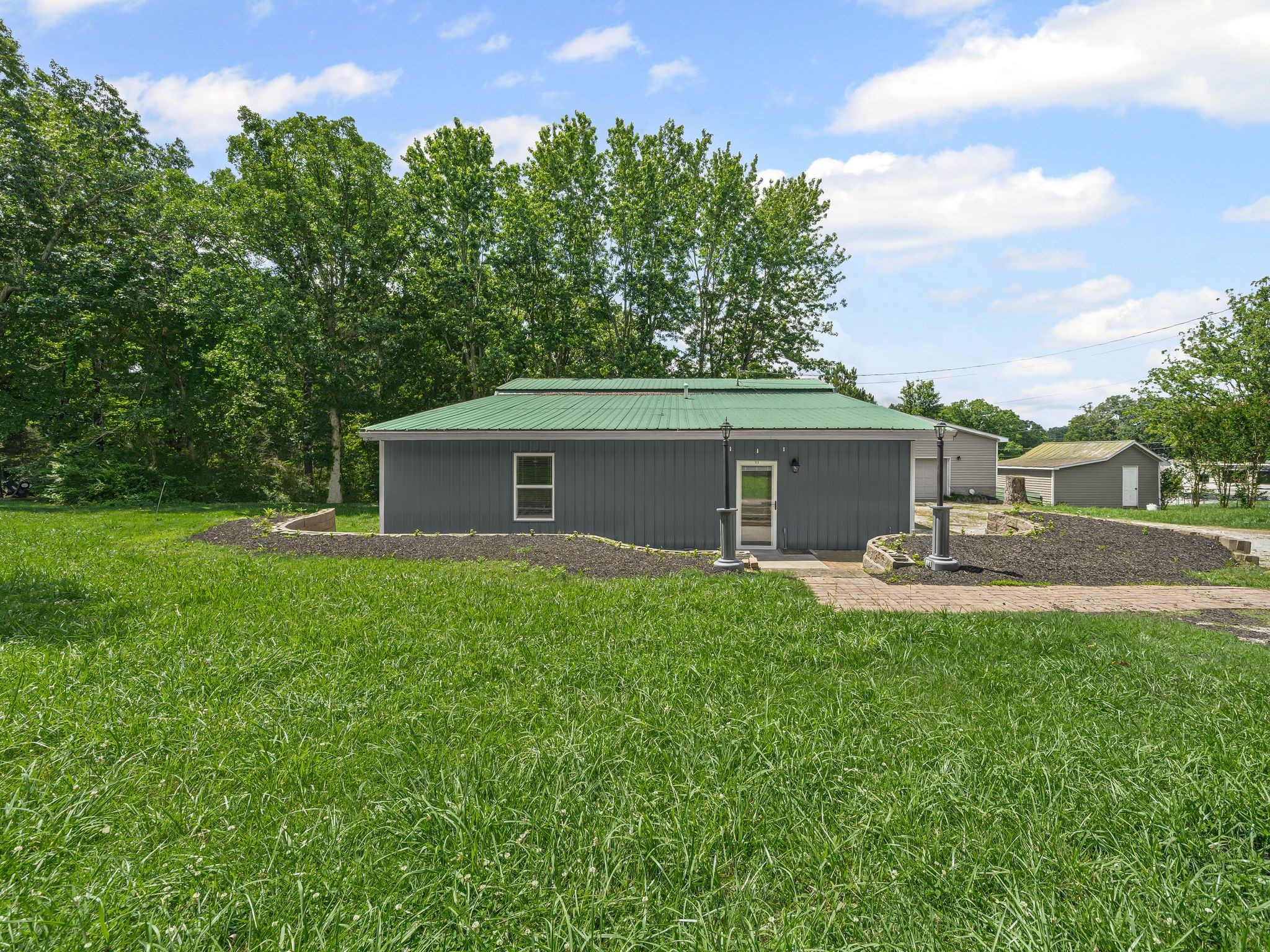 111 Brannon Circle Dickson, TN 37055 - Photo 29 of 34 a front view of house with yard and trees