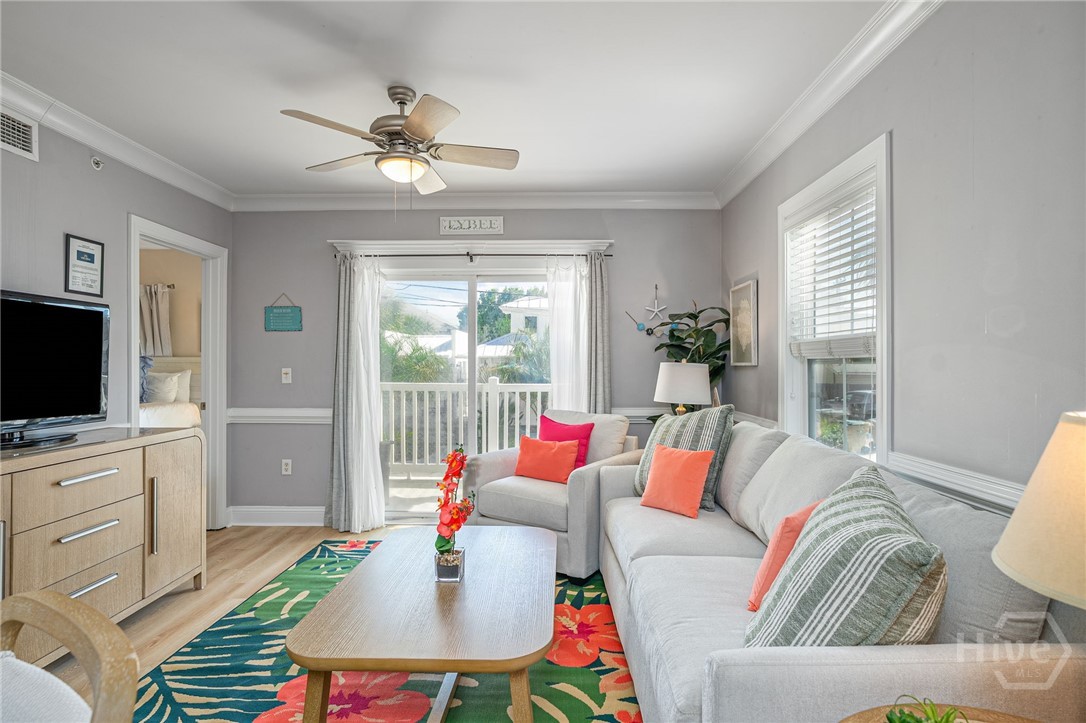 18 Silver Avenue, Unit 1 Tybee Island, GA 31328 - Photo 2 of 50 Living Room with Sliding Glass Door leading to Private Balcony with Partial Ocean View.