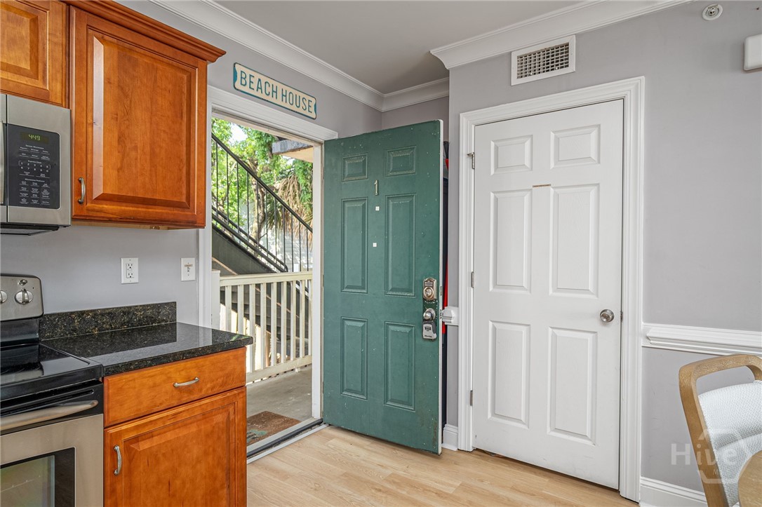 18 Silver Avenue, Unit 1 Tybee Island, GA 31328 - Photo 8 of 50 Kitchen w/Stainless Steel Appliances & Granite Countertops