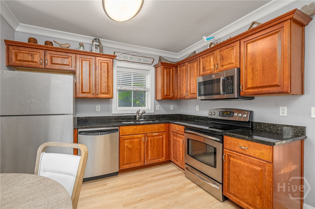 18 Silver Avenue, Unit 1 Tybee Island, GA 31328 - Photo 9 of 50 Kitchen w/Stainless Steel Appliances & Granite Countertops