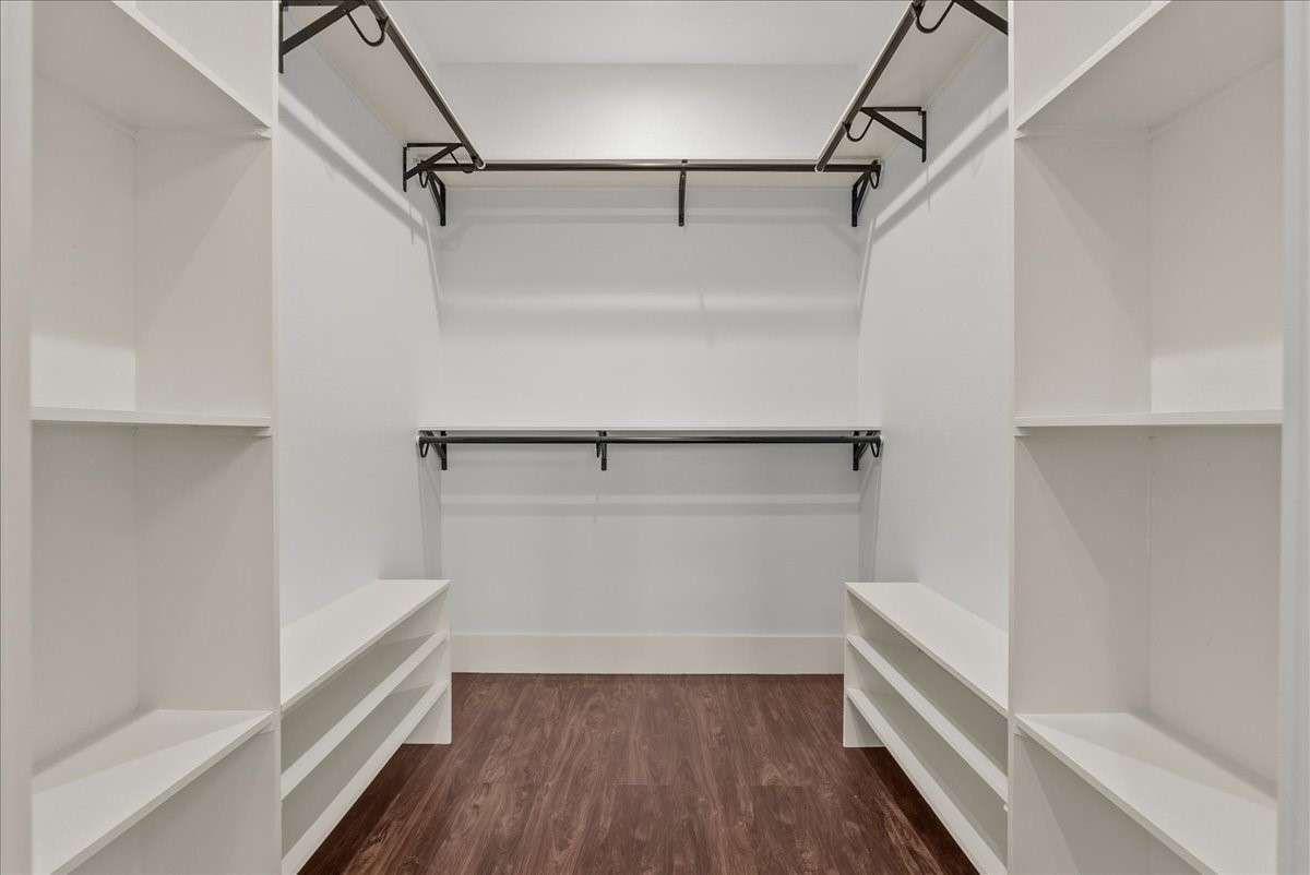 3237 Harkey Road Pearland, TX 77584 - Photo 20 of 46 Expansive walk-in closet with custom built-in storage.