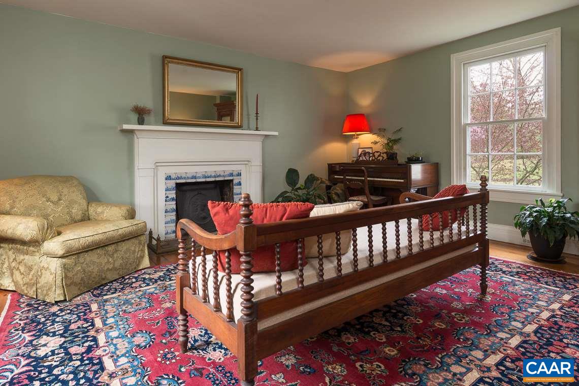 7124 Plank Road Charlottesville, VA 22903 - Photo 8 of 16 a living room with furniture and a fireplace