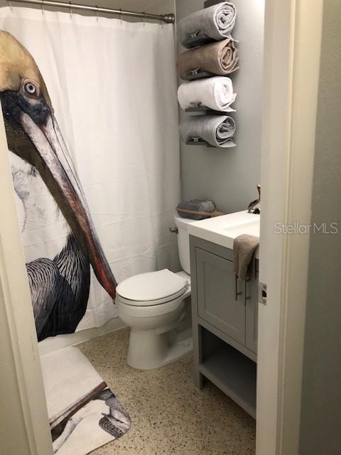 2625 South Atlantic Avenue, Unit 4 Cocoa Beach, FL 32931 - Photo 13 of 14 a bathroom with a toilet and a sink