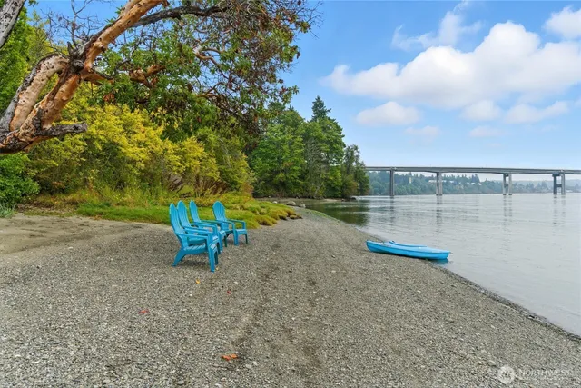 a view of a lake with a table and a chair