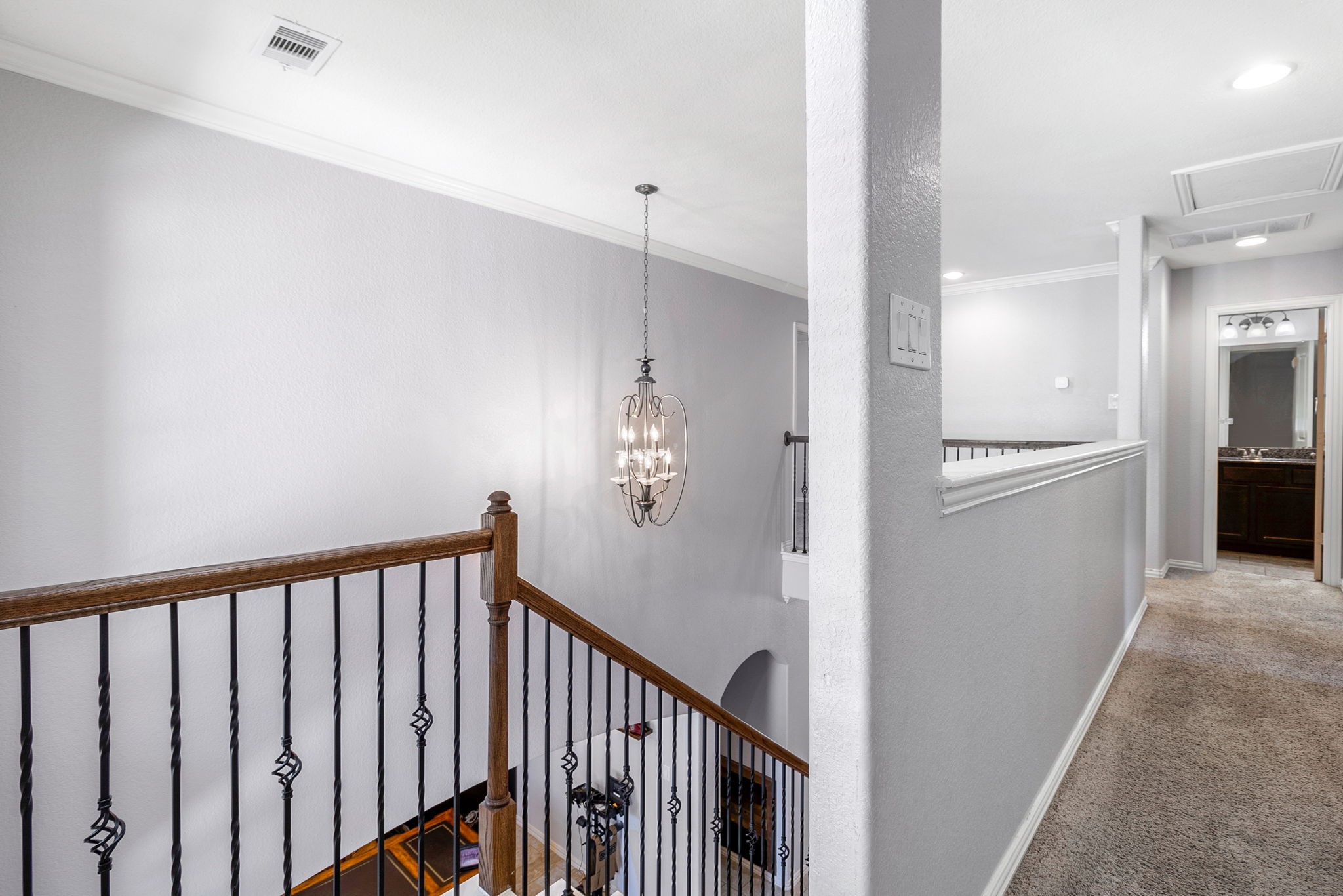 9014 San Saba Way Willis, TX 77378 - Photo 12 of 18 a view of a hallway with wooden floor
