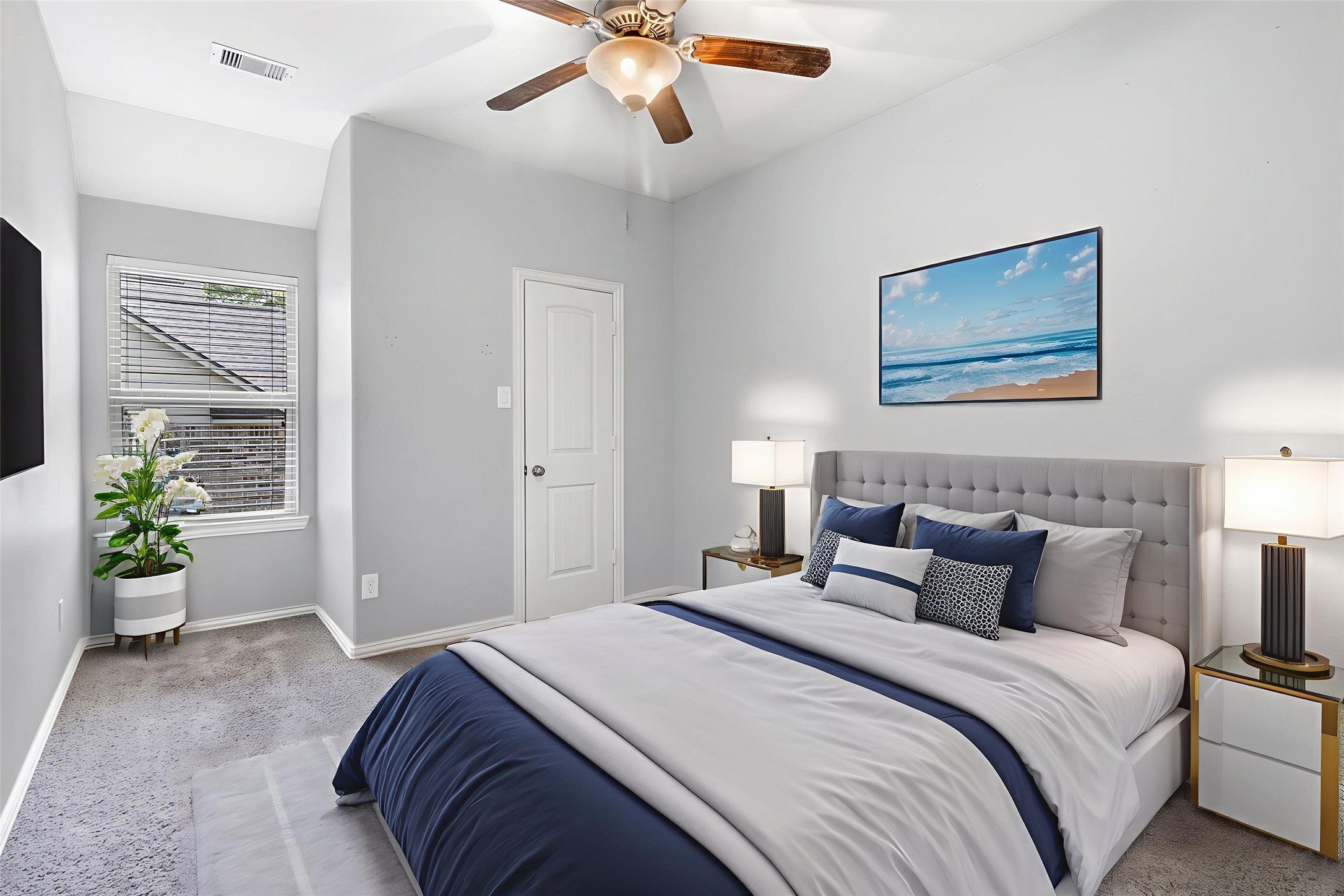 9014 San Saba Way Willis, TX 77378 - Photo 14 of 18 a bedroom with bed and a chandelier