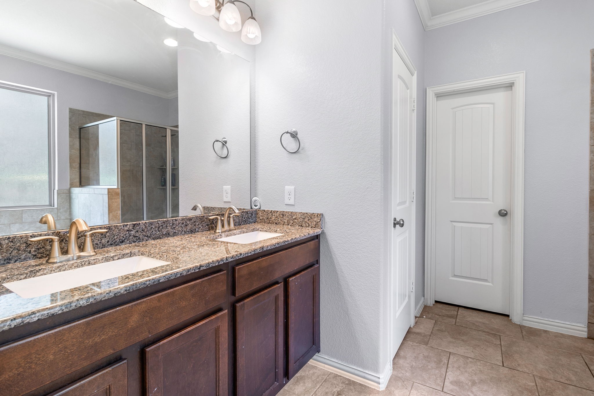 9014 San Saba Way Willis, TX 77378 - Photo 10 of 18 a bathroom with a granite countertop sink and a mirror