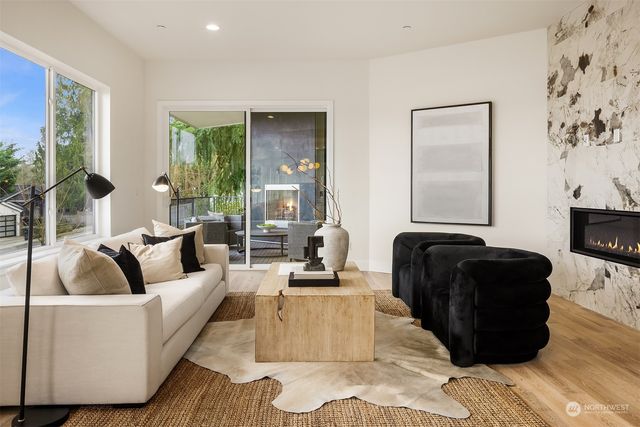 a living room with furniture and large windows