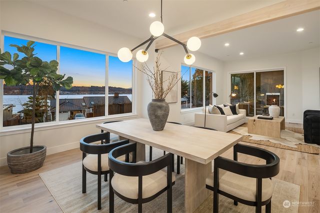 a view of a dining room with furniture and chandelier