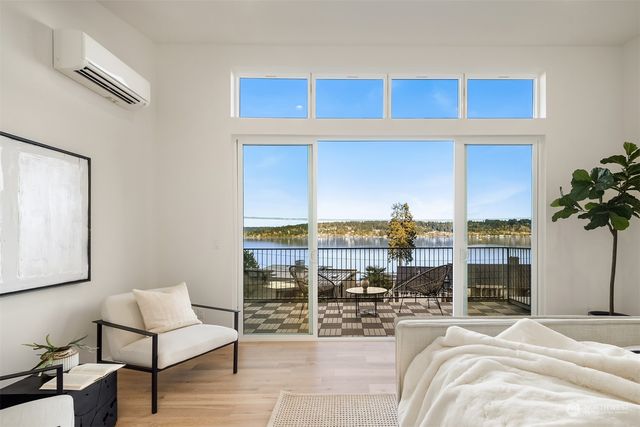 a view of a living room and a balcony
