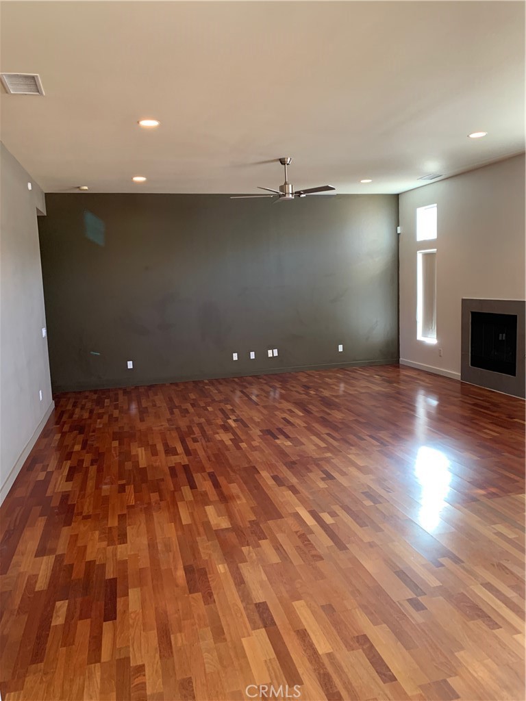 60055 Overture Drive Palm Springs, CA 92262 - Photo 19 of 19 a view of an empty room with wooden floor and a window
