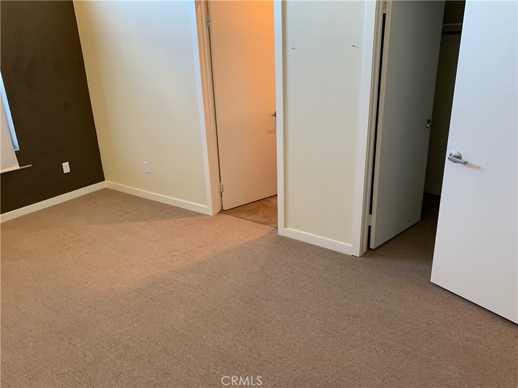 60055 Overture Drive Palm Springs, CA 92262 - Photo 9 of 19 an empty room with a window