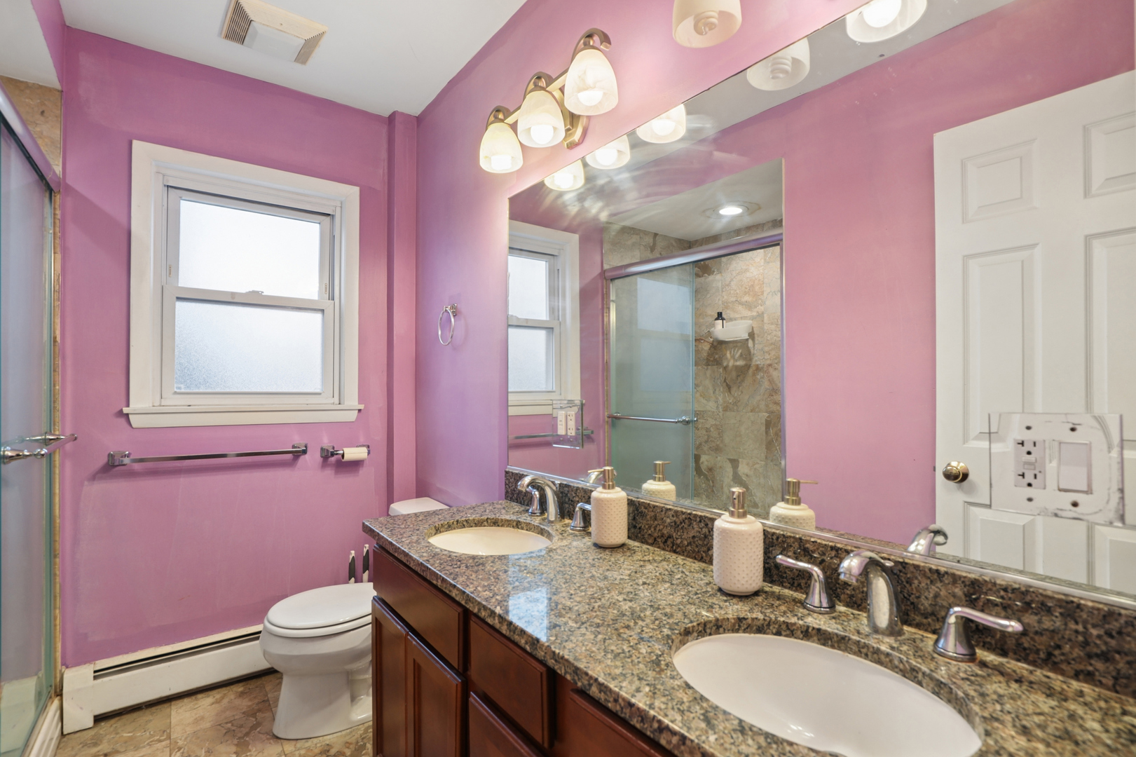 2147 Ridge Avenue, Unit 2D Evanston, IL 60201 - Photo 18 of 22 a bathroom with a granite countertop sink a toilet and a mirror