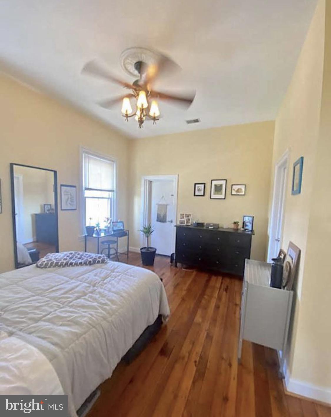101 Fayette Street, Unit 3 Conshohocken, PA 19428 - Photo 14 of 22 a bedroom with a bed and wooden floor
