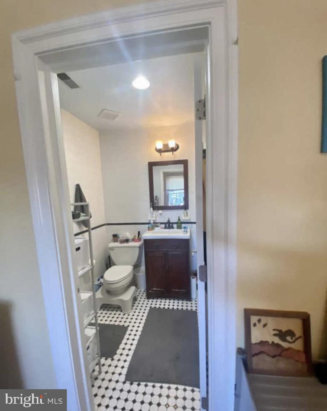 101 Fayette Street, Unit 3 Conshohocken, PA 19428 - Photo 18 of 22 a bathroom with a toilet a sink a mirror and vanity