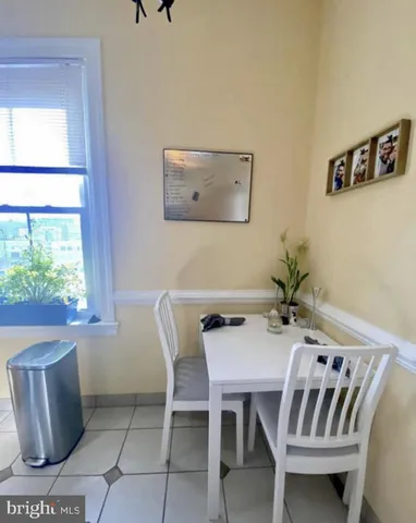 a kitchen with stainless steel appliances granite countertop a refrigerator a stove and a sink