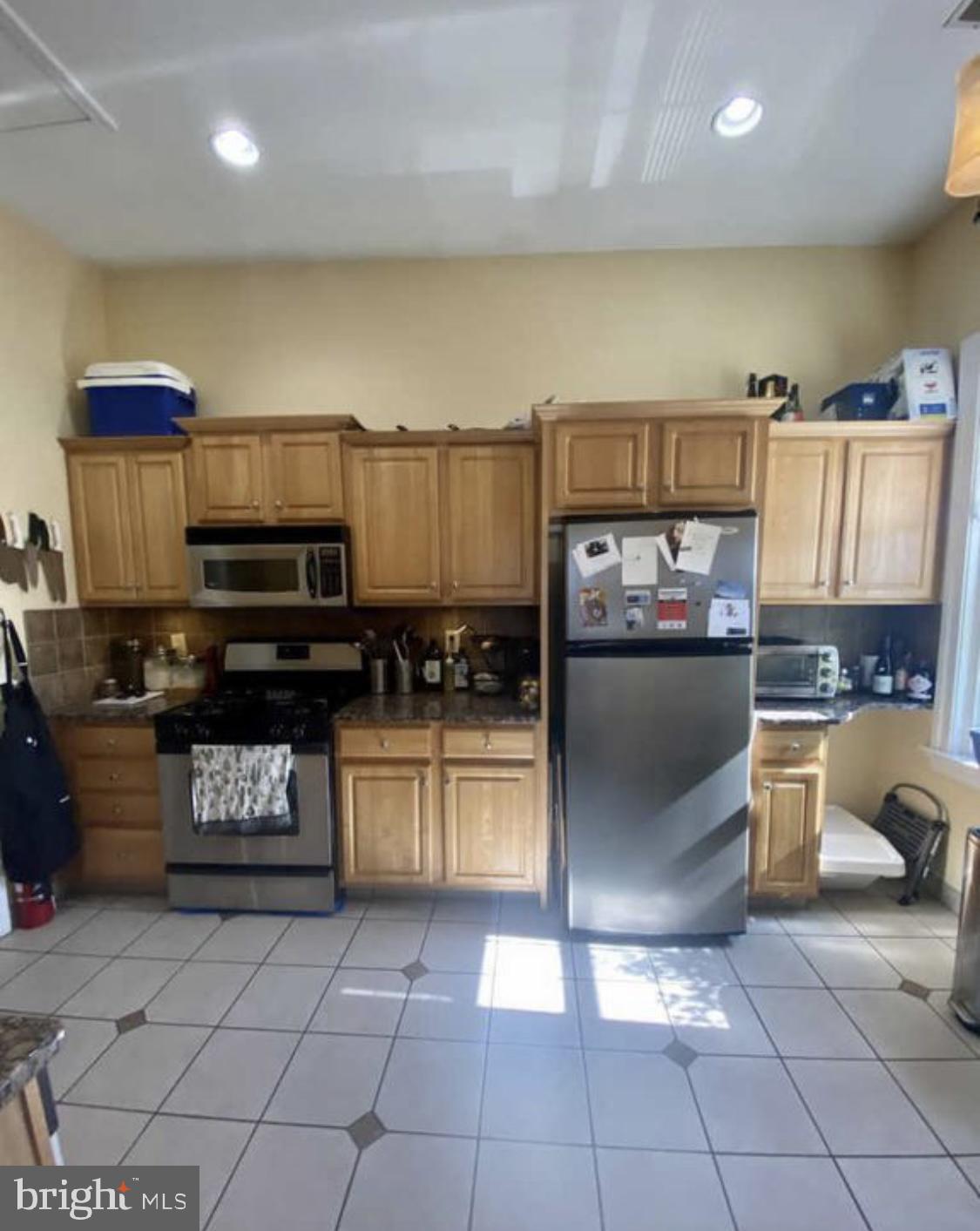101 Fayette Street, Unit 3 Conshohocken, PA 19428 - Photo 9 of 22 a kitchen with stainless steel appliances granite countertop a refrigerator a stove and a sink