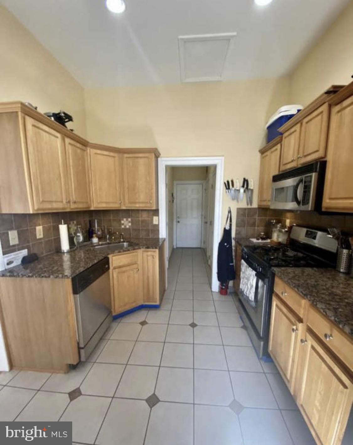 101 Fayette Street, Unit 3 Conshohocken, PA 19428 - Photo 10 of 22 a large kitchen with stainless steel appliances and a stove top oven