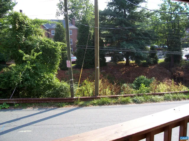 a view of mirror and small yard