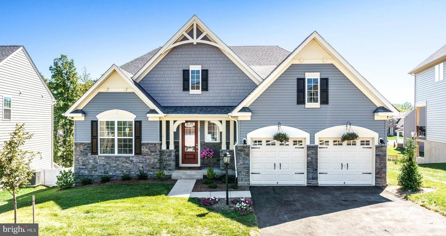 23 Tankard Road Stafford, VA 22554 - Photo 1 of 29 a front view of a house with a yard and garage