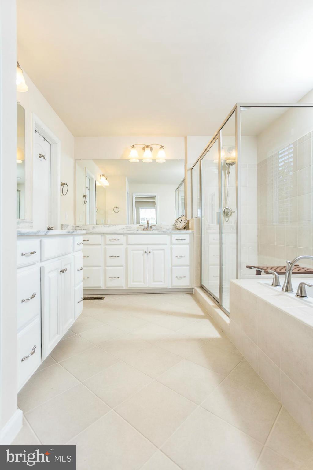 23 Tankard Road Stafford, VA 22554 - Photo 13 of 29 a large white bathroom with a tub sink and mirror