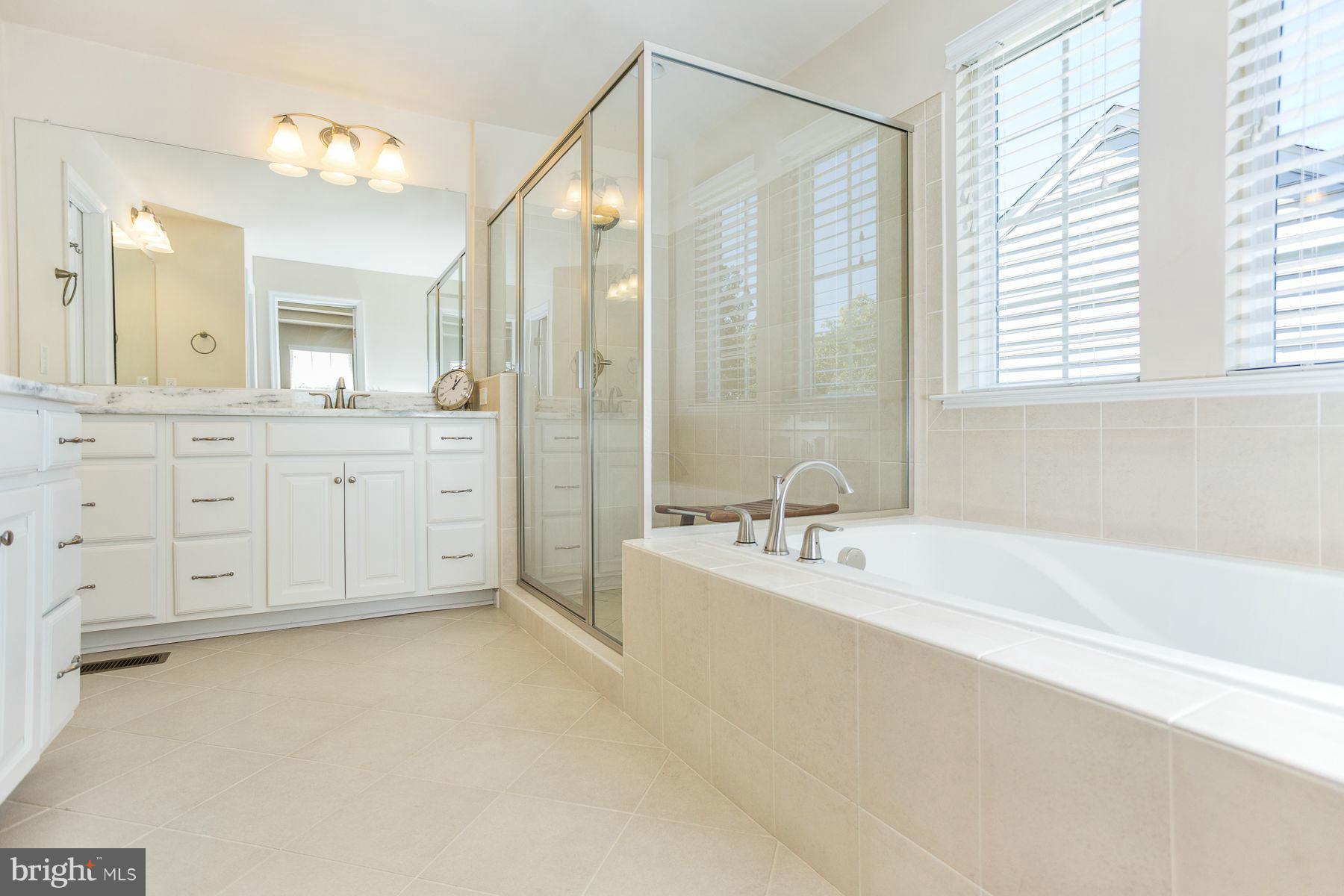 23 Tankard Road Stafford, VA 22554 - Photo 14 of 29 a bathroom with a tub sink double vanity and mirror