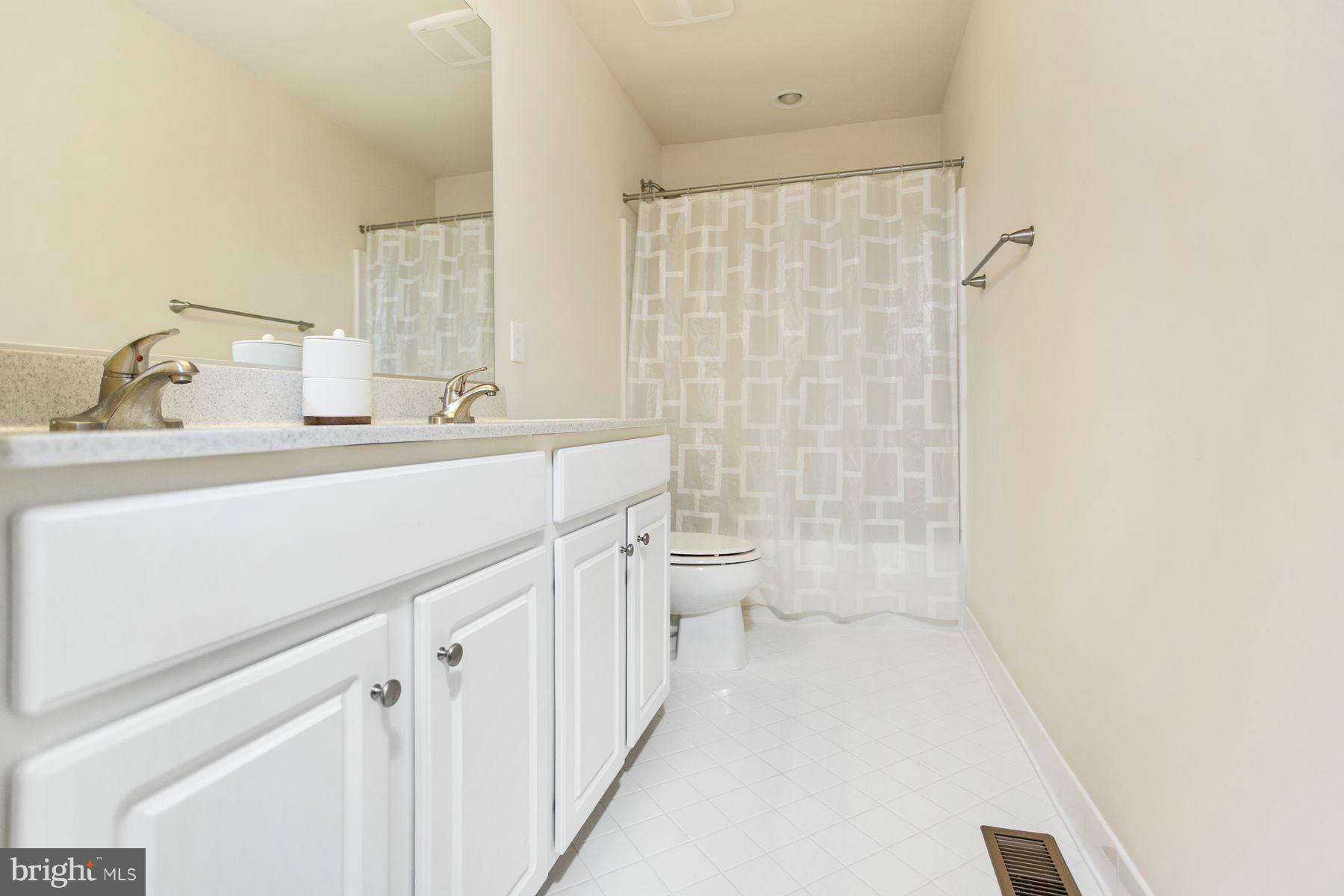 23 Tankard Road Stafford, VA 22554 - Photo 16 of 29 a bathroom with a sink a toilet and shower