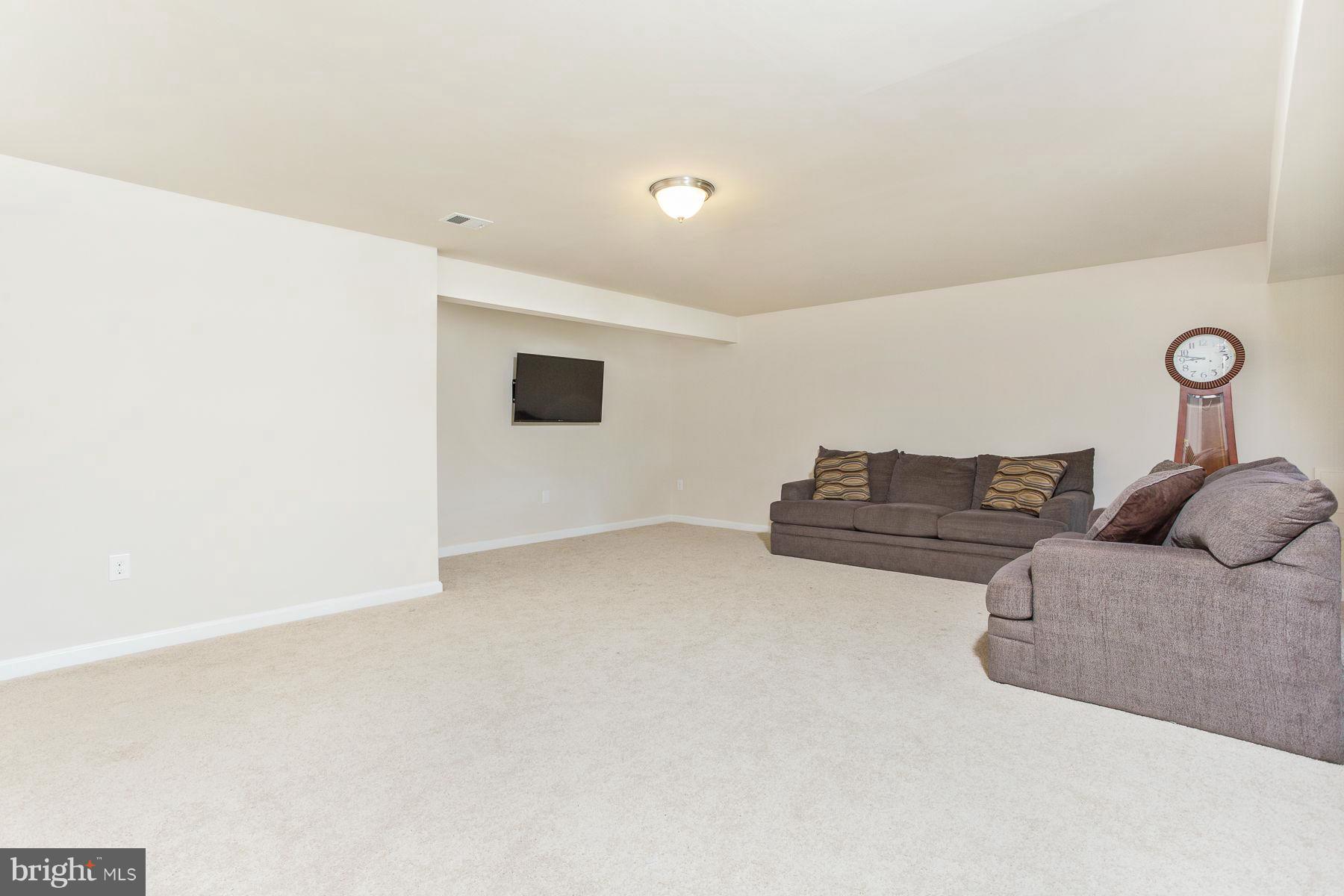 23 Tankard Road Stafford, VA 22554 - Photo 20 of 29 a living room with couches and kitchen view