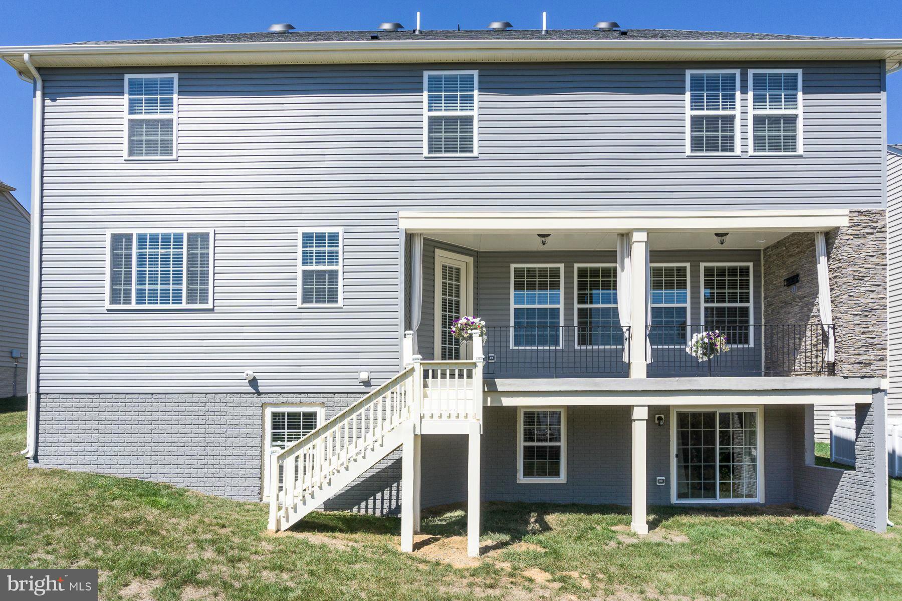 23 Tankard Road Stafford, VA 22554 - Photo 25 of 29 a front view of a house with a yard