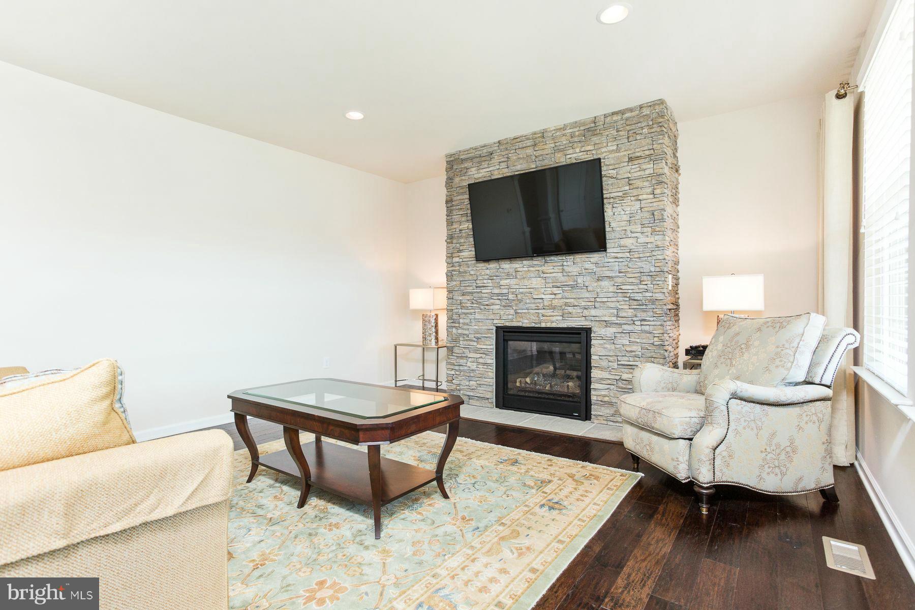 23 Tankard Road Stafford, VA 22554 - Photo 5 of 29 a living room with furniture and a fireplace