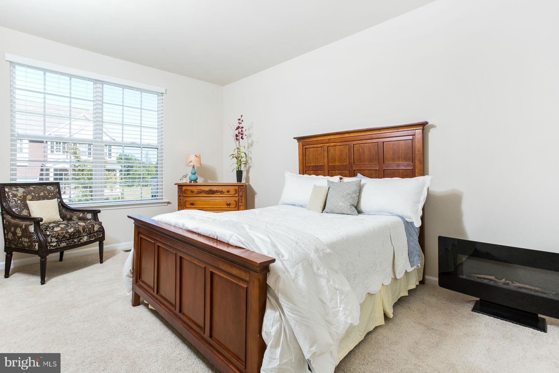 23 Tankard Road Stafford, VA 22554 - Photo 8 of 29 a bedroom with a bed and a couch