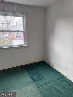 493 Wheatsheaf Road Springfield, PA 19064 - Photo 16 of 25 a view of an empty room with a window