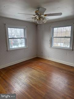 493 Wheatsheaf Road Springfield, PA 19064 - Photo 17 of 25 an empty room with wooden floor fan and windows