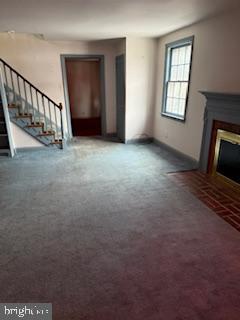 493 Wheatsheaf Road Springfield, PA 19064 - Photo 3 of 25 a view of an empty room with wooden floor and a window