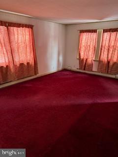 493 Wheatsheaf Road Springfield, PA 19064 - Photo 10 of 25 an empty room with wooden floor and windows