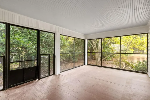 a view of an empty room with a large window