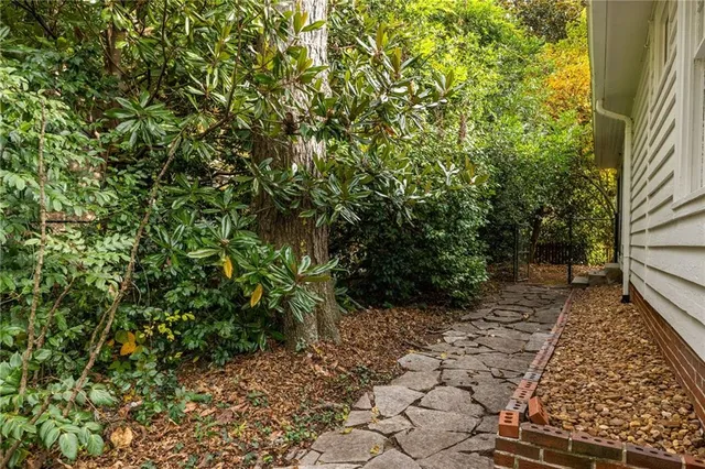a backyard of a house with lots of green space