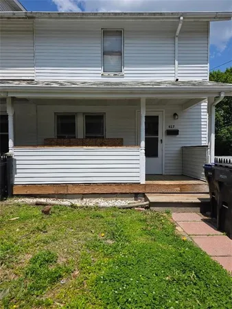 a view of a house with a large window and a stairs