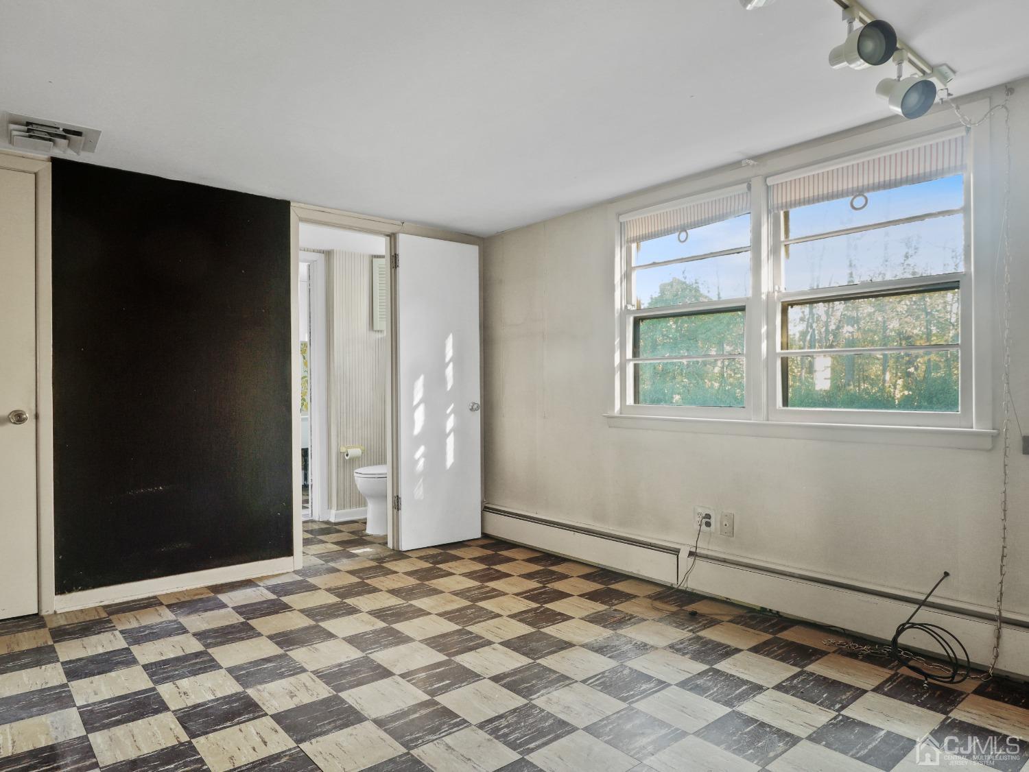 29 Princeton Road Cranford, NJ 07016 - Photo 16 of 24 a view of an empty room with a window
