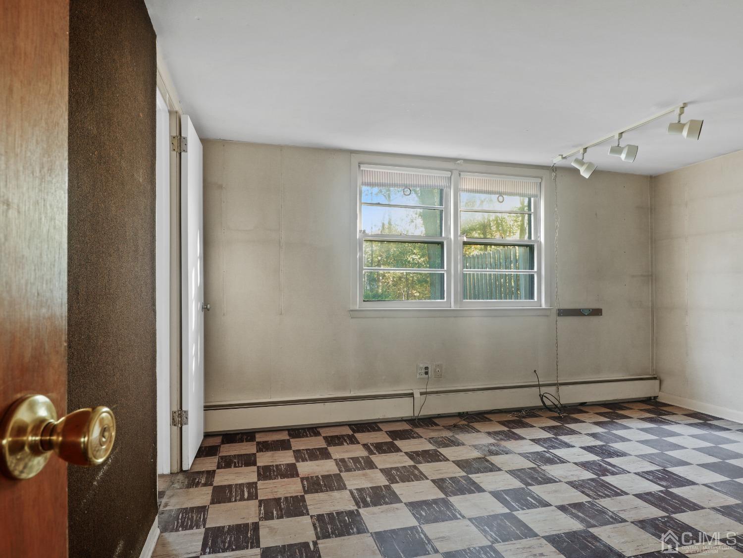 29 Princeton Road Cranford, NJ 07016 - Photo 17 of 24 a view of a livingroom with wooden floor and a window