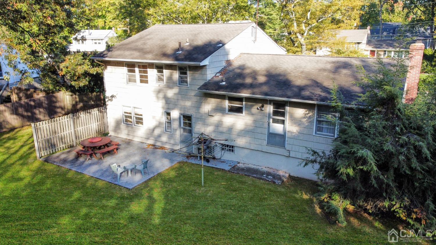 29 Princeton Road Cranford, NJ 07016 - Photo 2 of 24 an aerial view of a house with table and chairs and a fire pit