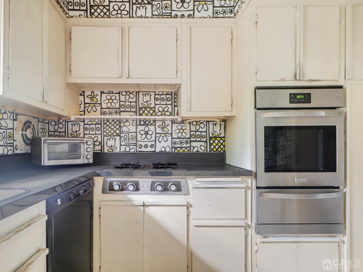 29 Princeton Road Cranford, NJ 07016 - Photo 4 of 24 a view of washer and dryer with kitchen countertops
