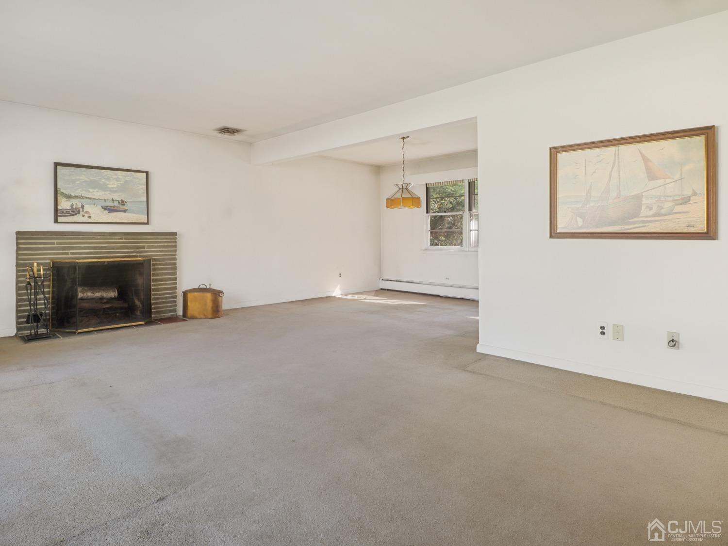 29 Princeton Road Cranford, NJ 07016 - Photo 7 of 24 a view of empty room with a fireplace