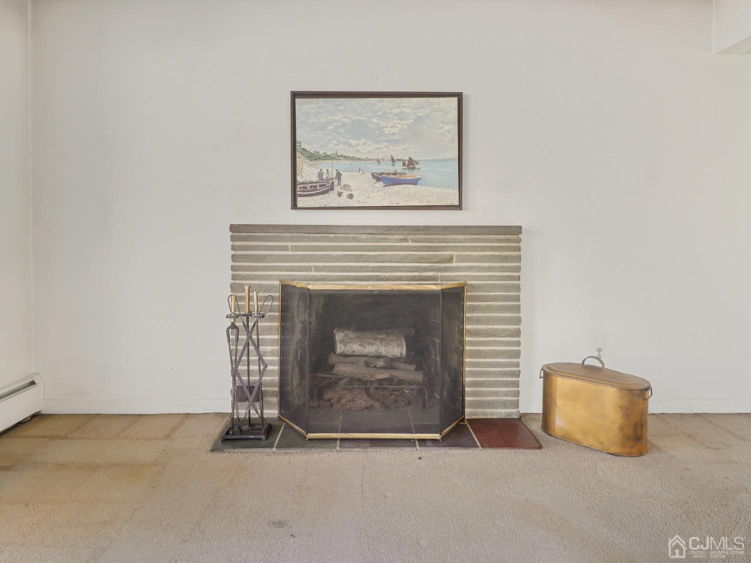 29 Princeton Road Cranford, NJ 07016 - Photo 8 of 24 a living room with a fireplace