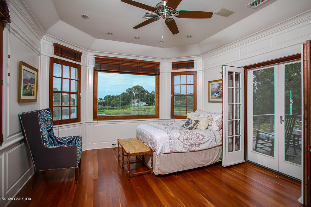 22 Cherry Tree Lane Riverside, CT 06878 - Photo 27 of 50 a living room with furniture and a large window