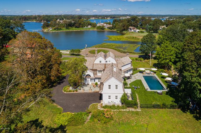 an aerial view of a house with a lake view
