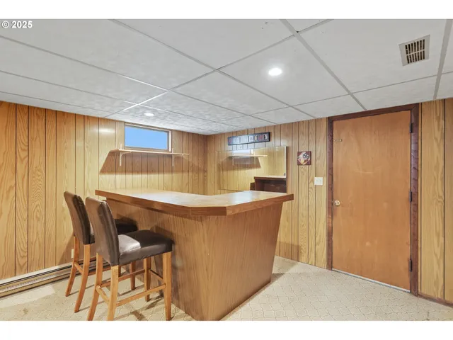 a room with a table and chairs